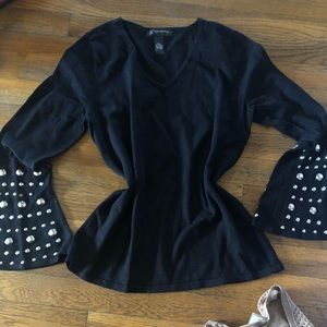 Bell sleeve sweater.